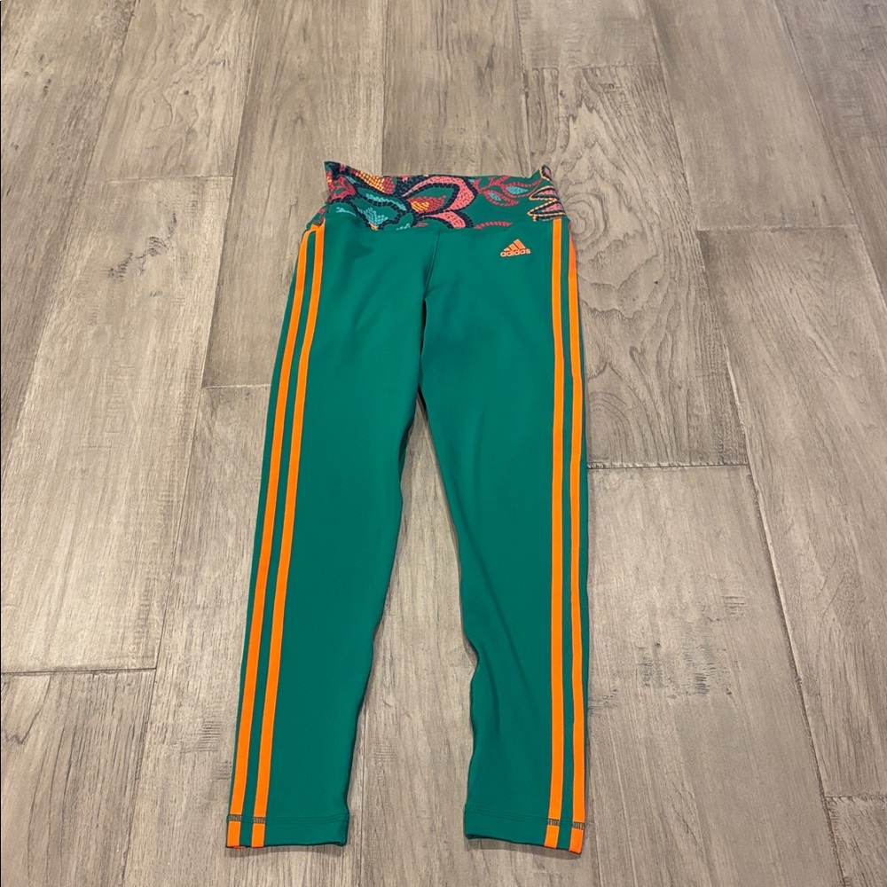 Adidas green Leggings with Orange Stripes.